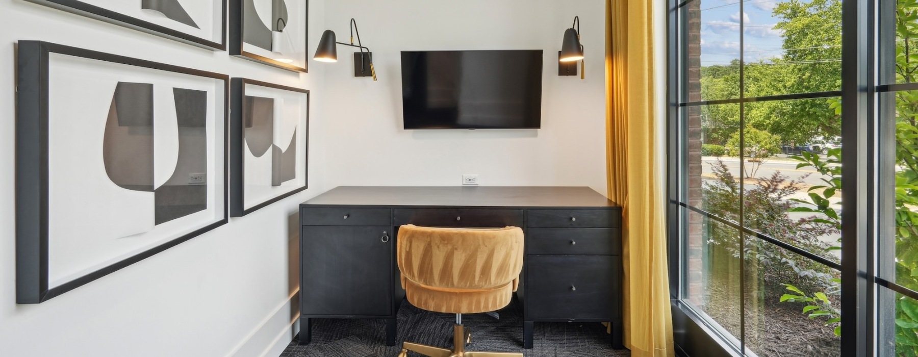 small room with chair, table and tv