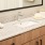 Bath with dual vanity, large mirror and glass enclosed shower