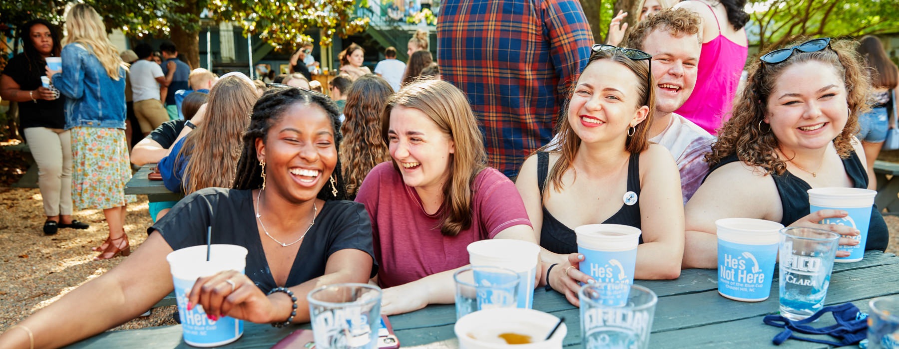 people sitting around a table laughing