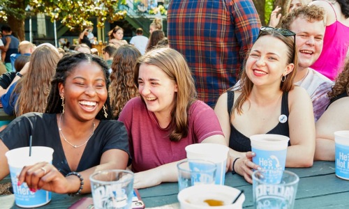 people sitting around a table laughing